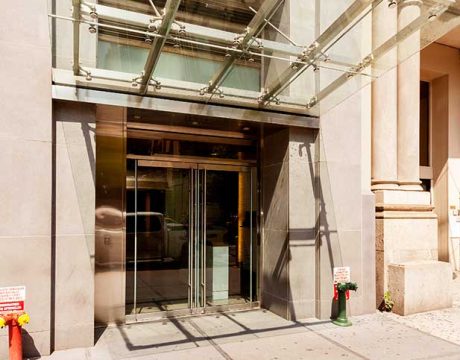 New Building Entrance with a Glass Marquis