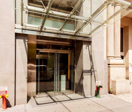 New Building Entrance with a Glass Marquis